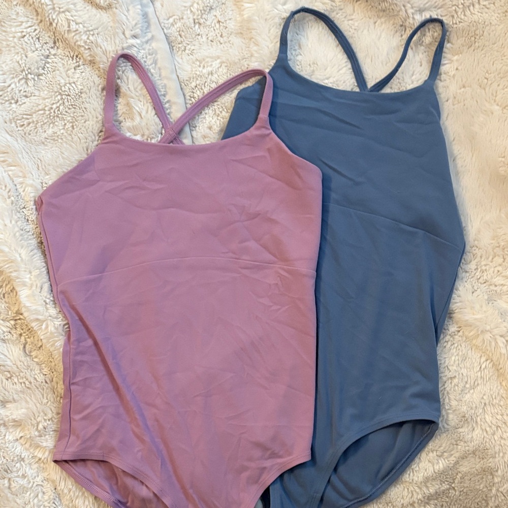 Set of Two Athleta Girl Leotards in Lavendar and Blue. Size Large.